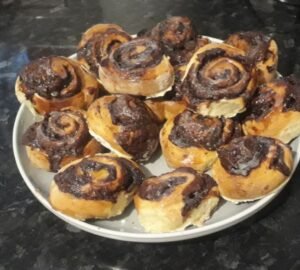 A plate of baked chocolate swirl pastries